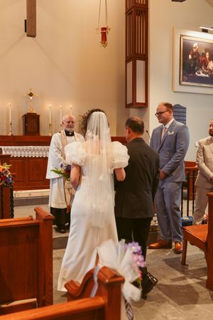 Walking sequence inside a church showing progression of a wedding ceremony with wooden pews and altar visible.