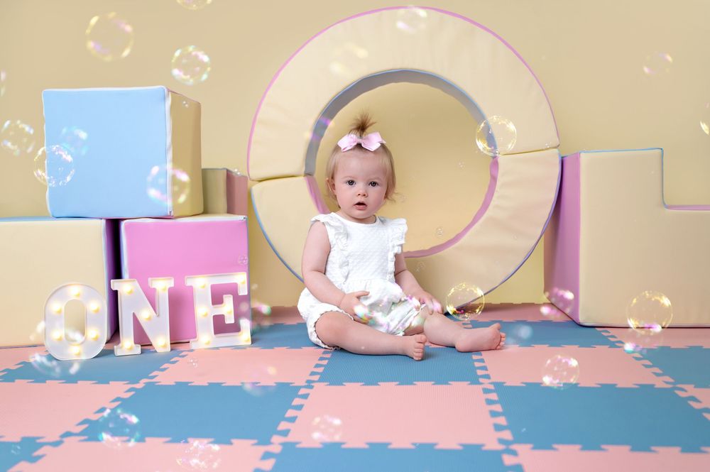 Modern nursery setup with interlocking foam floor mats in soft pastel colors.