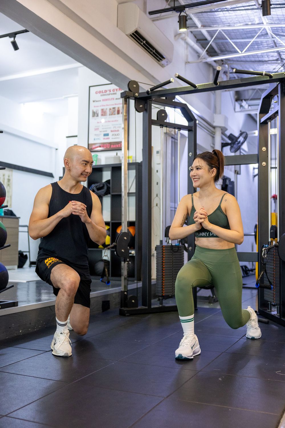 Step by step demonstration of how to perform proper lunges exercise technique in a gym setting with weight equipment.