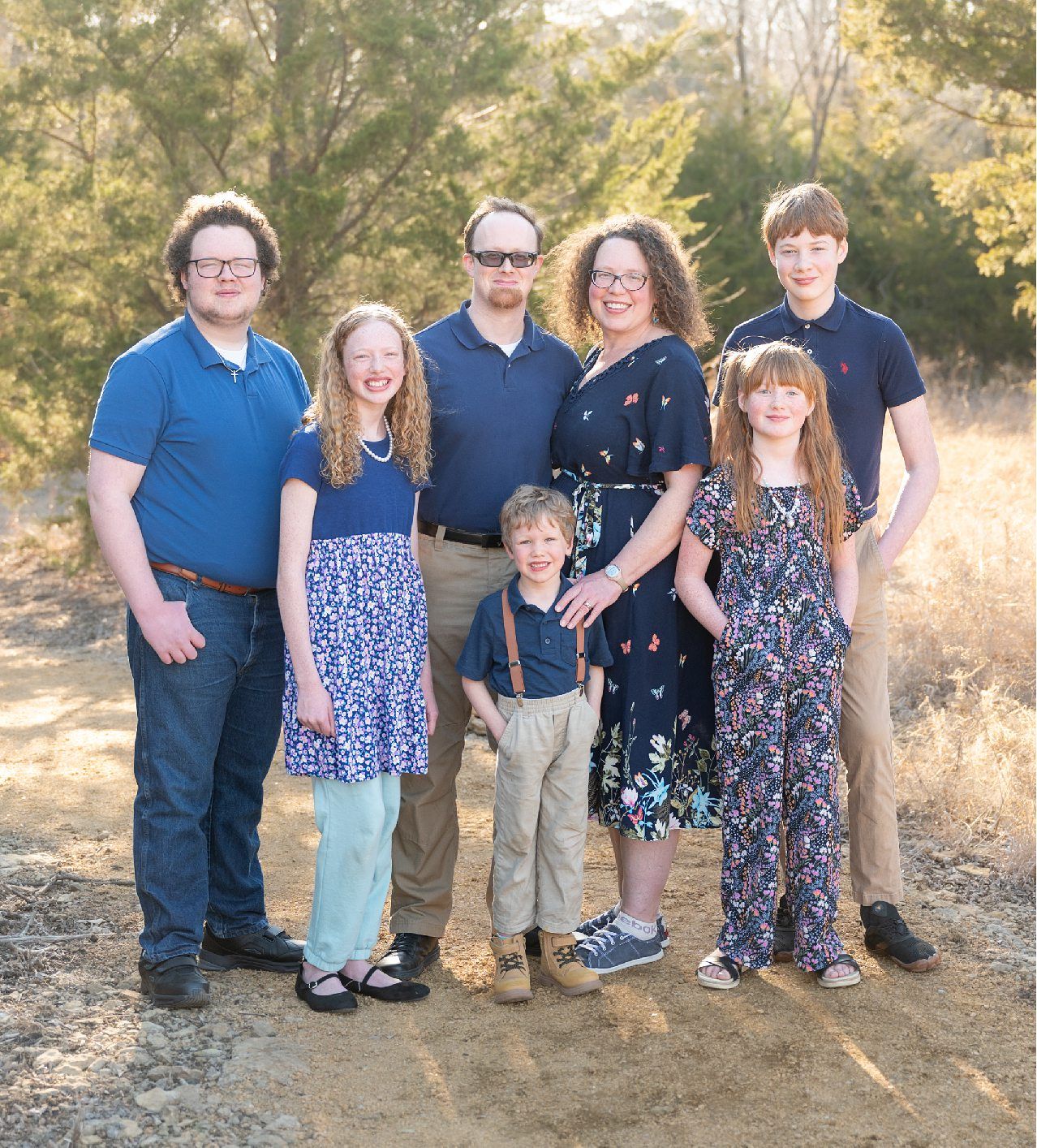 Family of 6 Late Winter Session in Field of Evergreens by Bartlesville Family Photographer Kristi Bray
