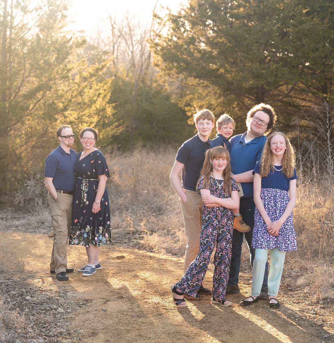 Family of 6 Late Winter Session in Field of Evergreens by Bartlesville Family Photographer Kristi Bray