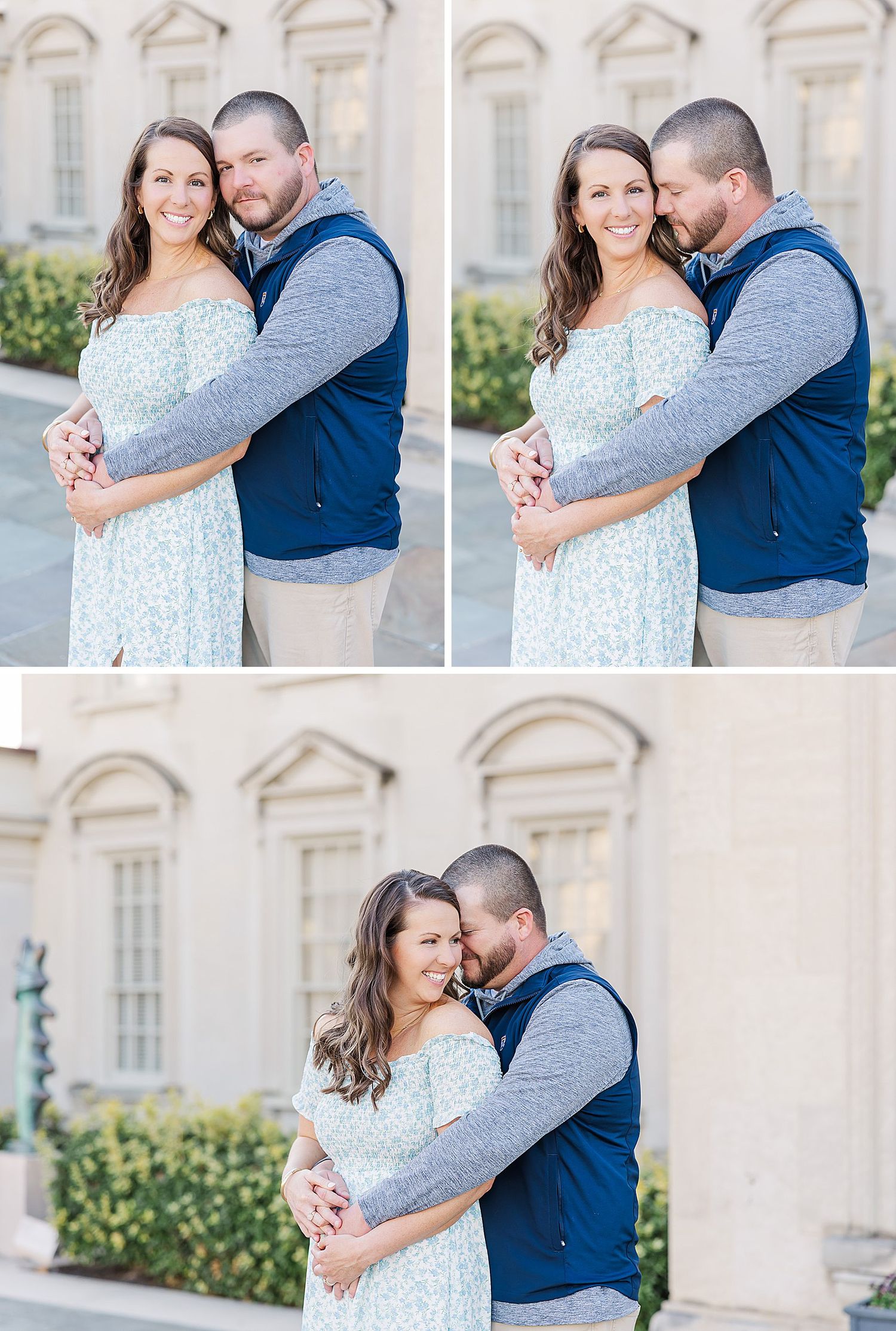 A romantic couple embraces outdoors in front of a classic stone building with arched windows during a portrait session.