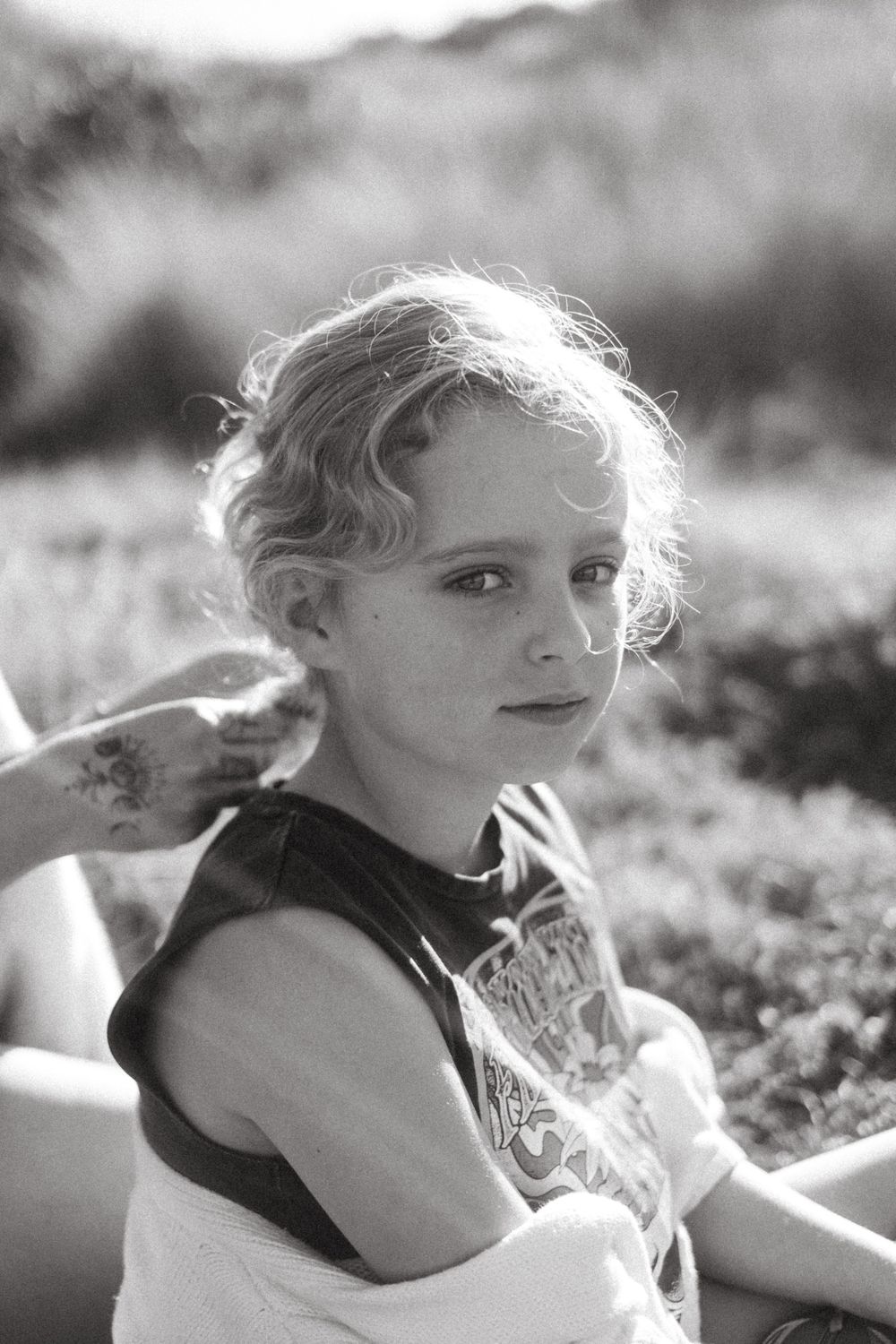 Dreamy black and white portrait in soft natural lighting with delicate details.