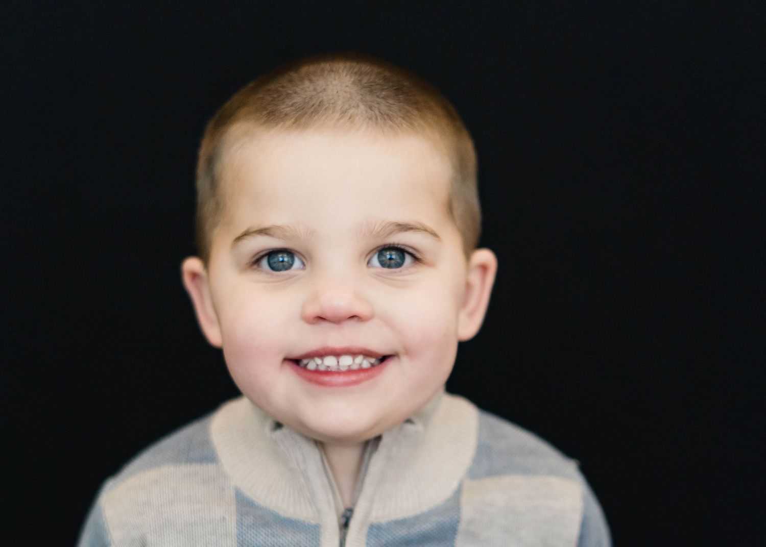 Curious toddler boy photographed during a daycare photo session in Brevard County.
