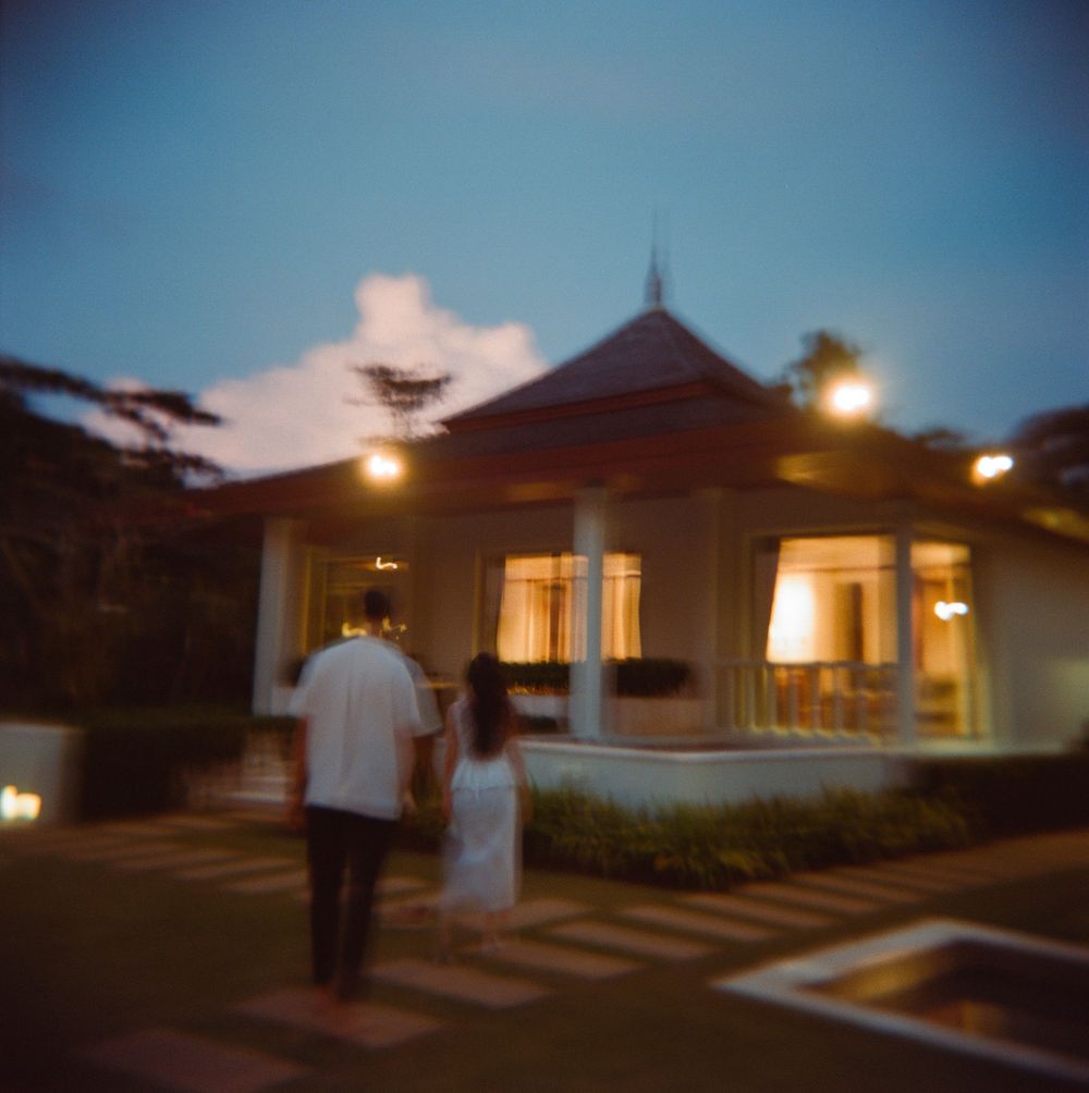 A series of exterior shots showing a house at dusk with warm glowing lights illuminating the facade.