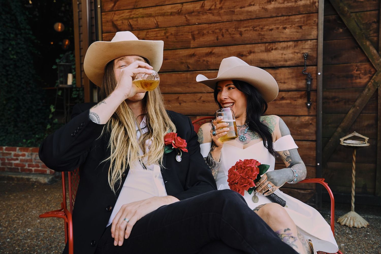 Casual outdoor gathering with drinks at a rustic venue.