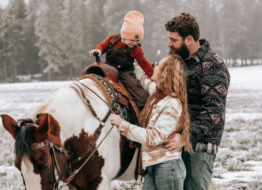 Cle Elum, WA Engagement family session walking toward camera with horse.