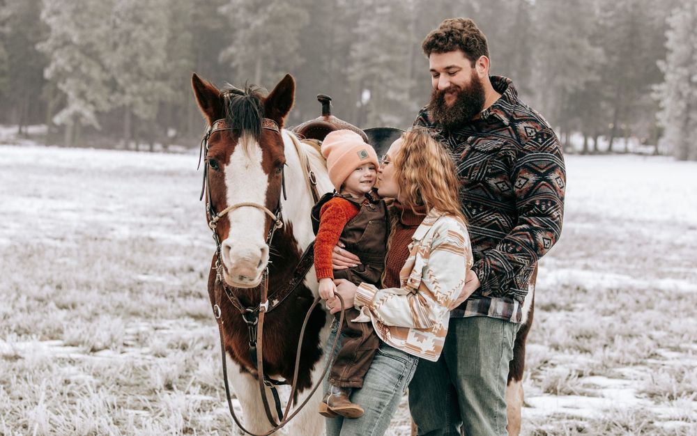 Cle Elum, WA Engagement family session walking toward camera with horse.