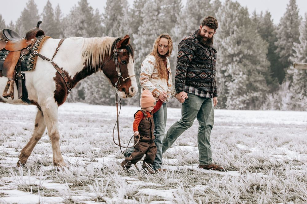 Cle Elum, WA Engagement family session walking toward camera with horse.