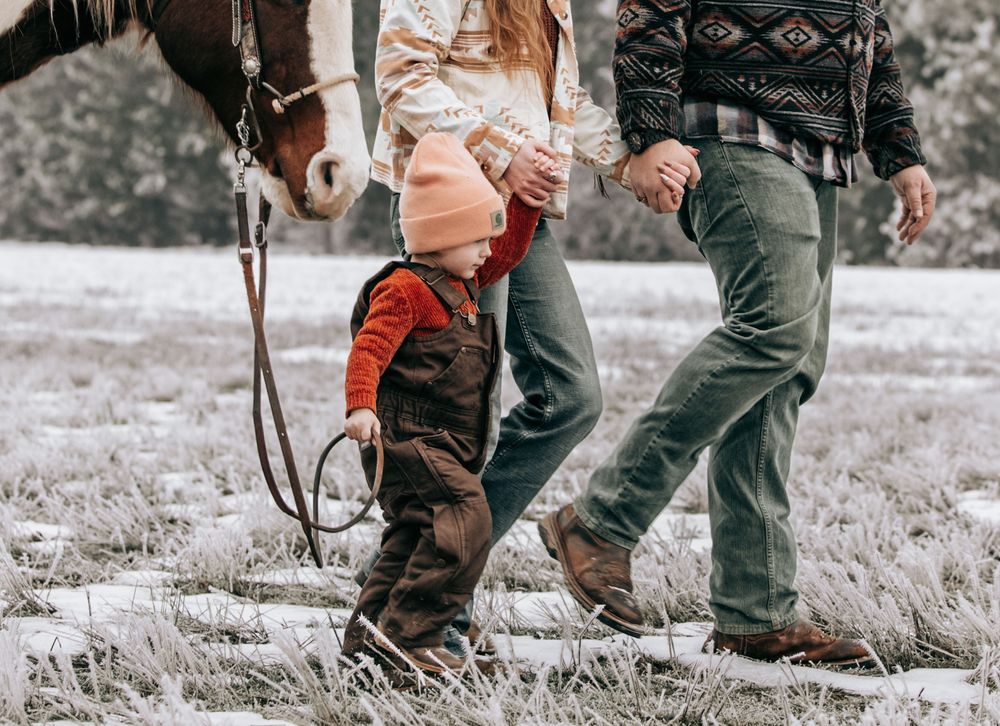 Cle Elum, WA Engagement family session walking toward camera with horse.