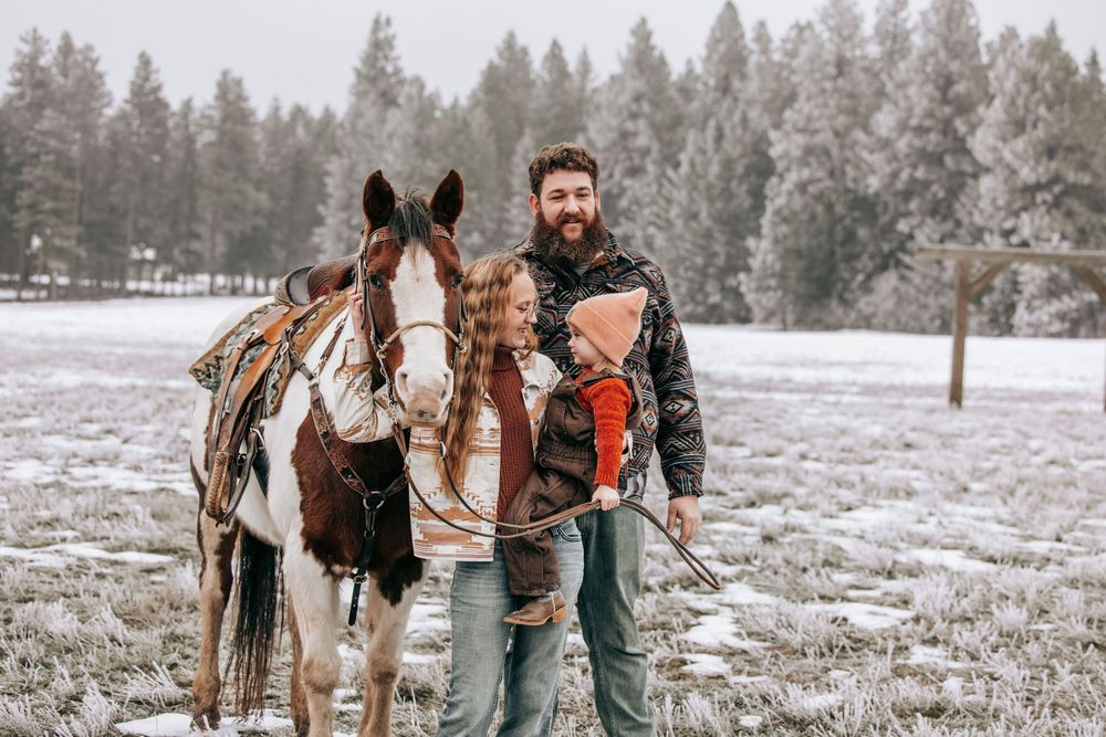 Cle Elum, WA Engagement family session walking toward camera with horse.