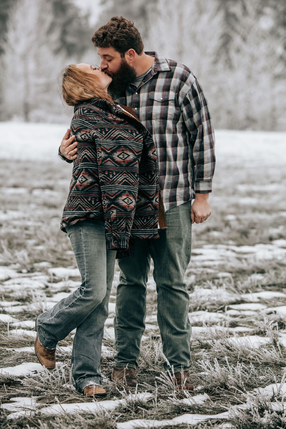 Cle Elum, WA Engagement session couple hugging each other in a wintery scene.