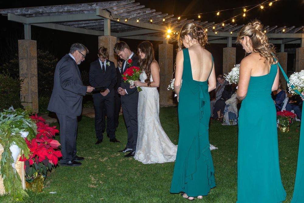 Bride walking down the aisle at Dallas Arboretum and Botanical Garden wedding surrounded by colorful blooms