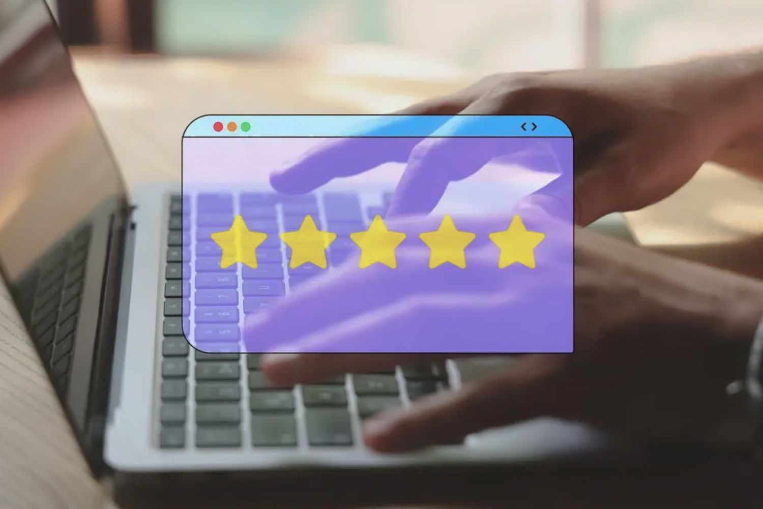 Five gold star rating display shown on a laptop screen with a hand typing on the keyboard in the background.