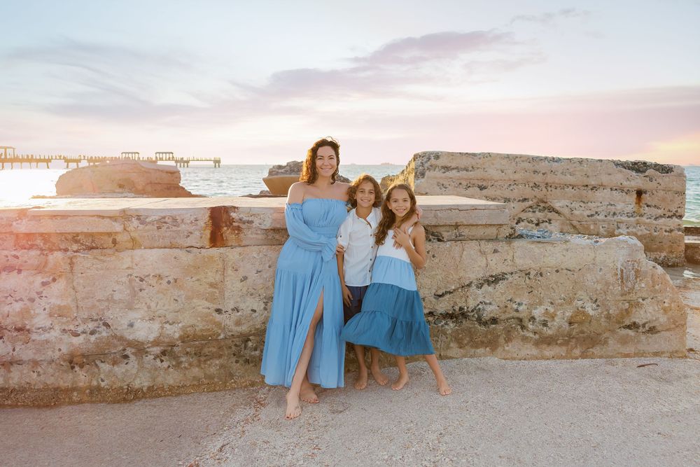 A rustic stone wall backdrop at the beach during golden hour.