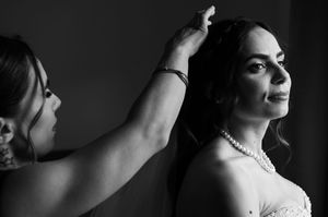 A series of black and white profile portraits showing dramatic lighting and elegant poses against dark backgrounds.