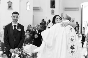 A black and white photo collage showing multiple wedding moments with couples and guests during a church ceremony.