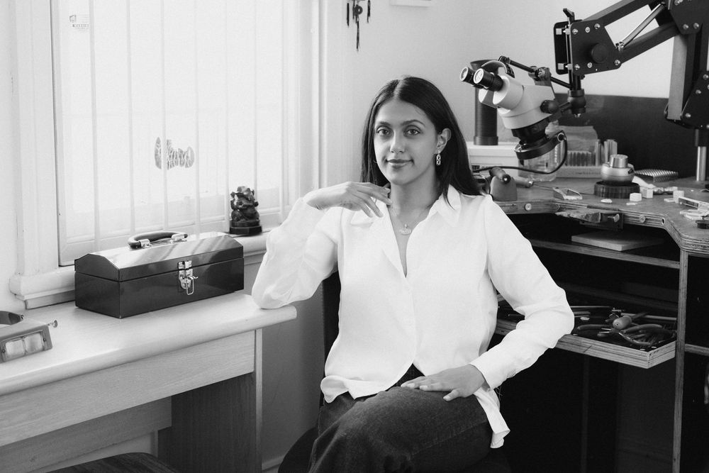 A collage of black and white photos showing office workers at desks with vintage computers and equipment from an earlier era.