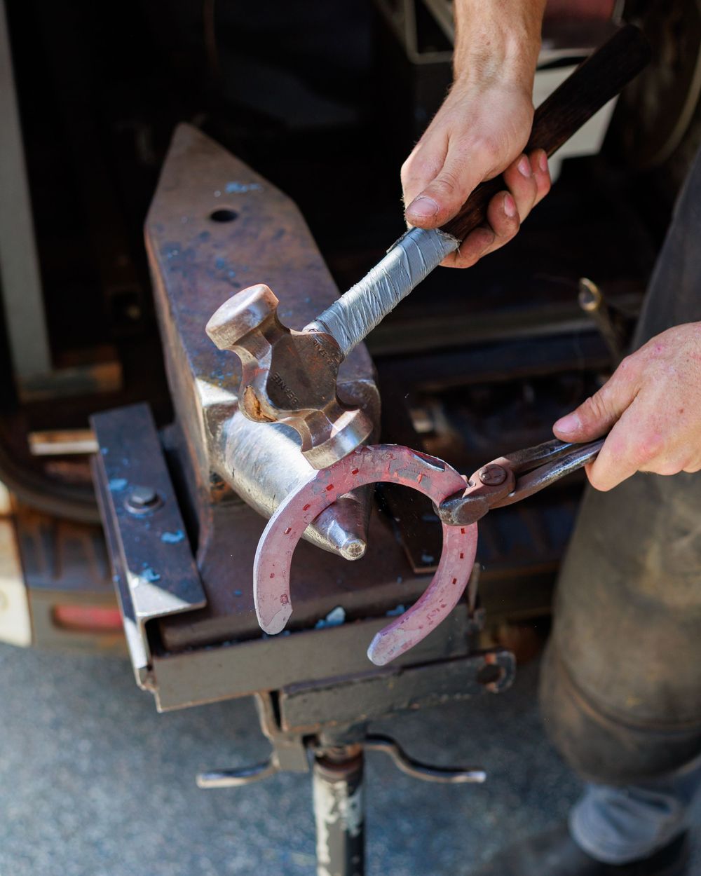 A series of photos showing hammering and shaping metal on an anvil during blacksmithing work.