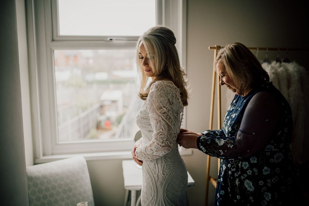 A series of intimate lifestyle photos showing a woman in white getting ready by a window with natural light streaming in.