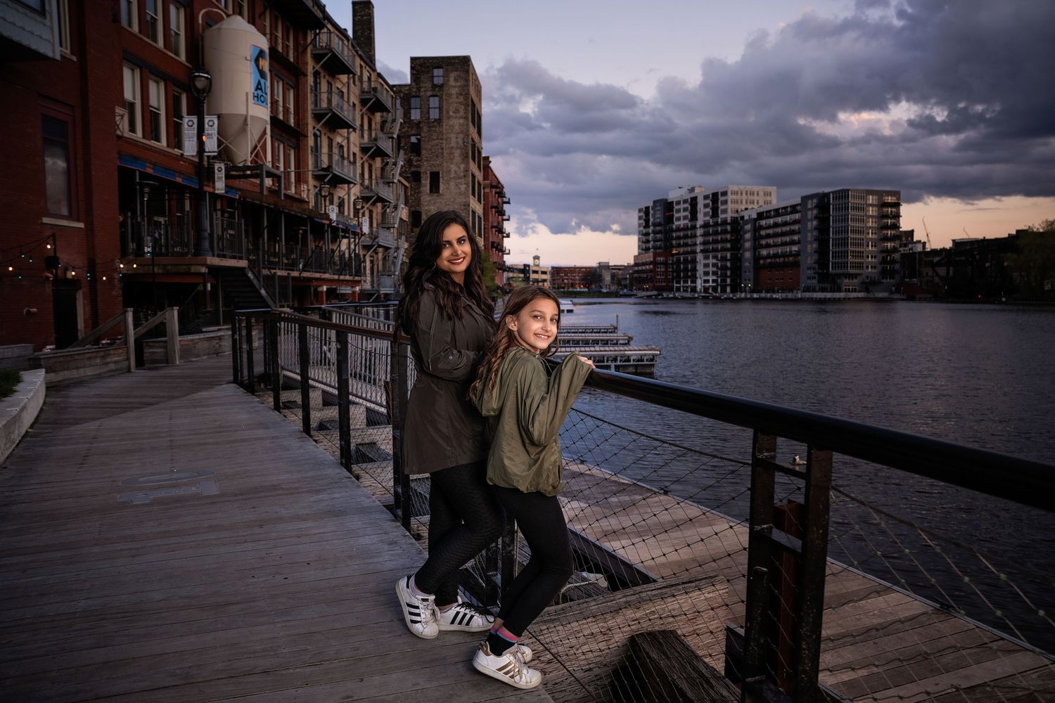 Florentina and her daughter sharing a joyful moment, captured in a heartwarming portrait.