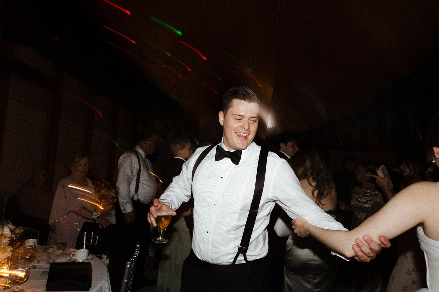 A sequence of blurry nighttime party photos showing people dancing and celebrating at an indoor event.