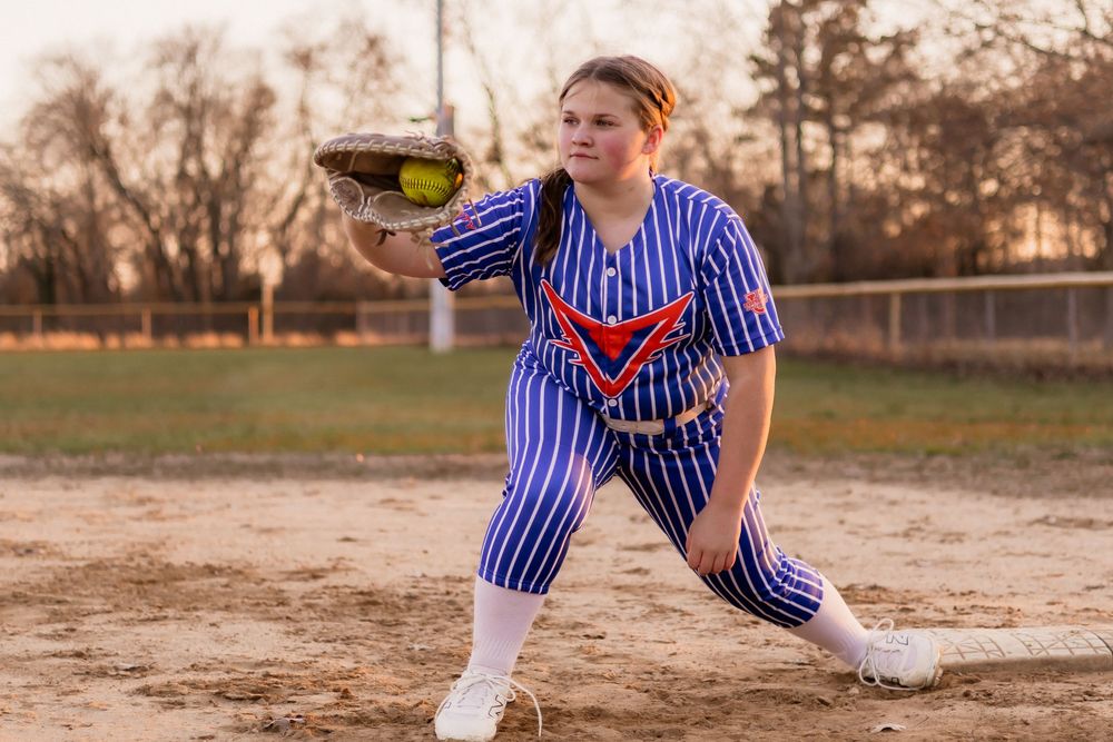 Multiple action shots showing softball pitching technique in blue striped uniform.