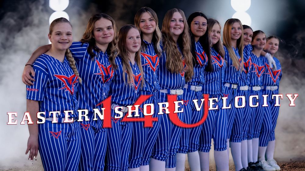 Team photo of softball players in blue striped uniforms with Shore Velocity Eastern Bay text.