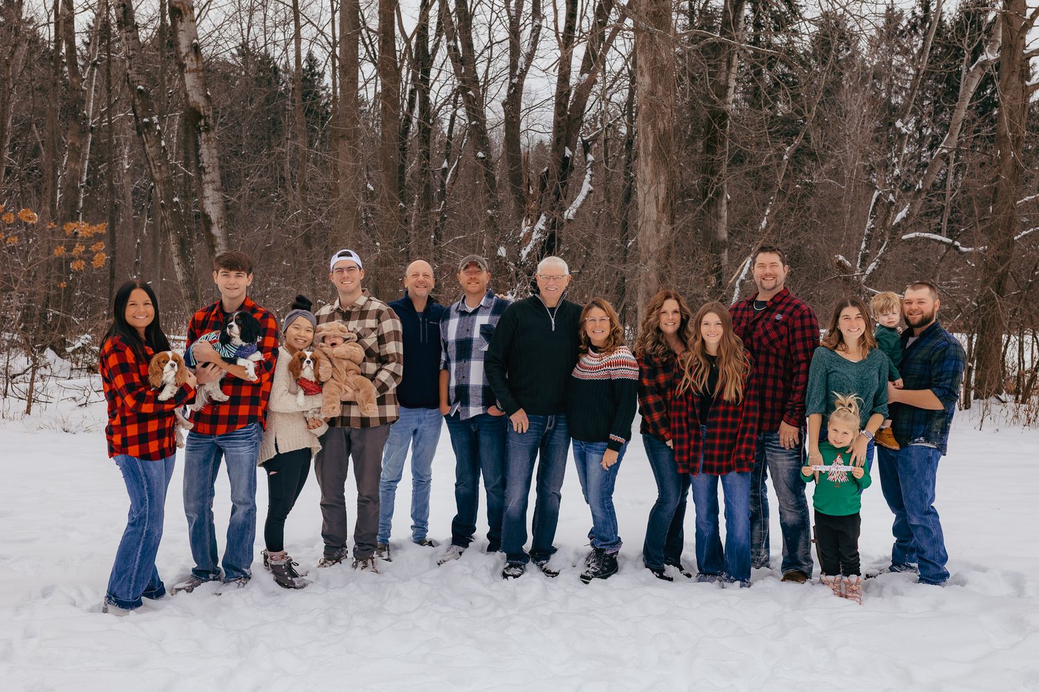 Extended family smiling together during their outdoor photography session in Wausau, wisconsin