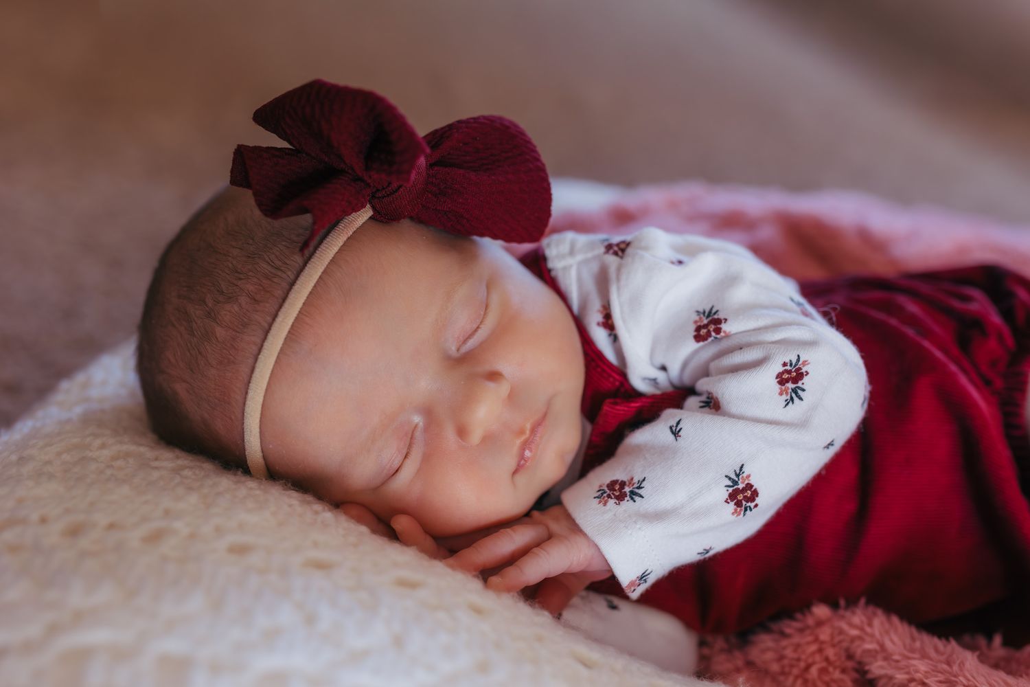 Sweet newborn sleeping peacefully during their lifestyle newborn session