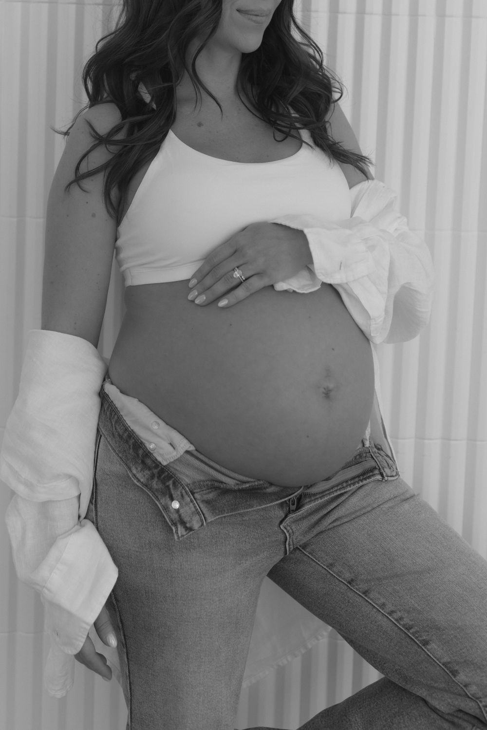 A person wearing jeans and a white top shows their midriff in a series of cropped photos against a light background.