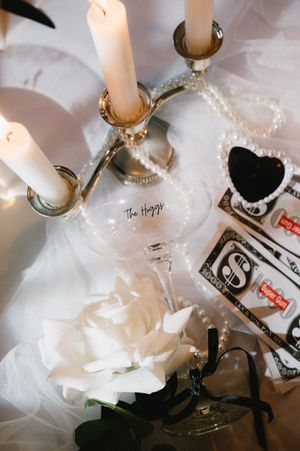 White tissue paper and decorative items create an ethereal artistic display with soft lighting and shadows.