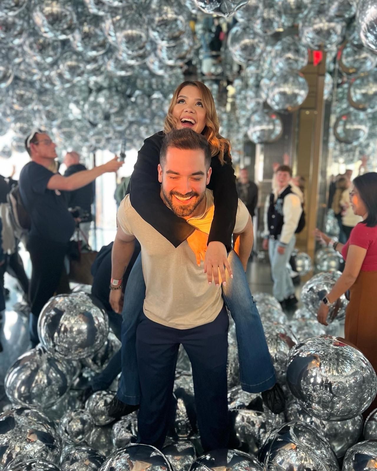 Joyful couple celebrating together as confetti falls around them during a wedding celebration