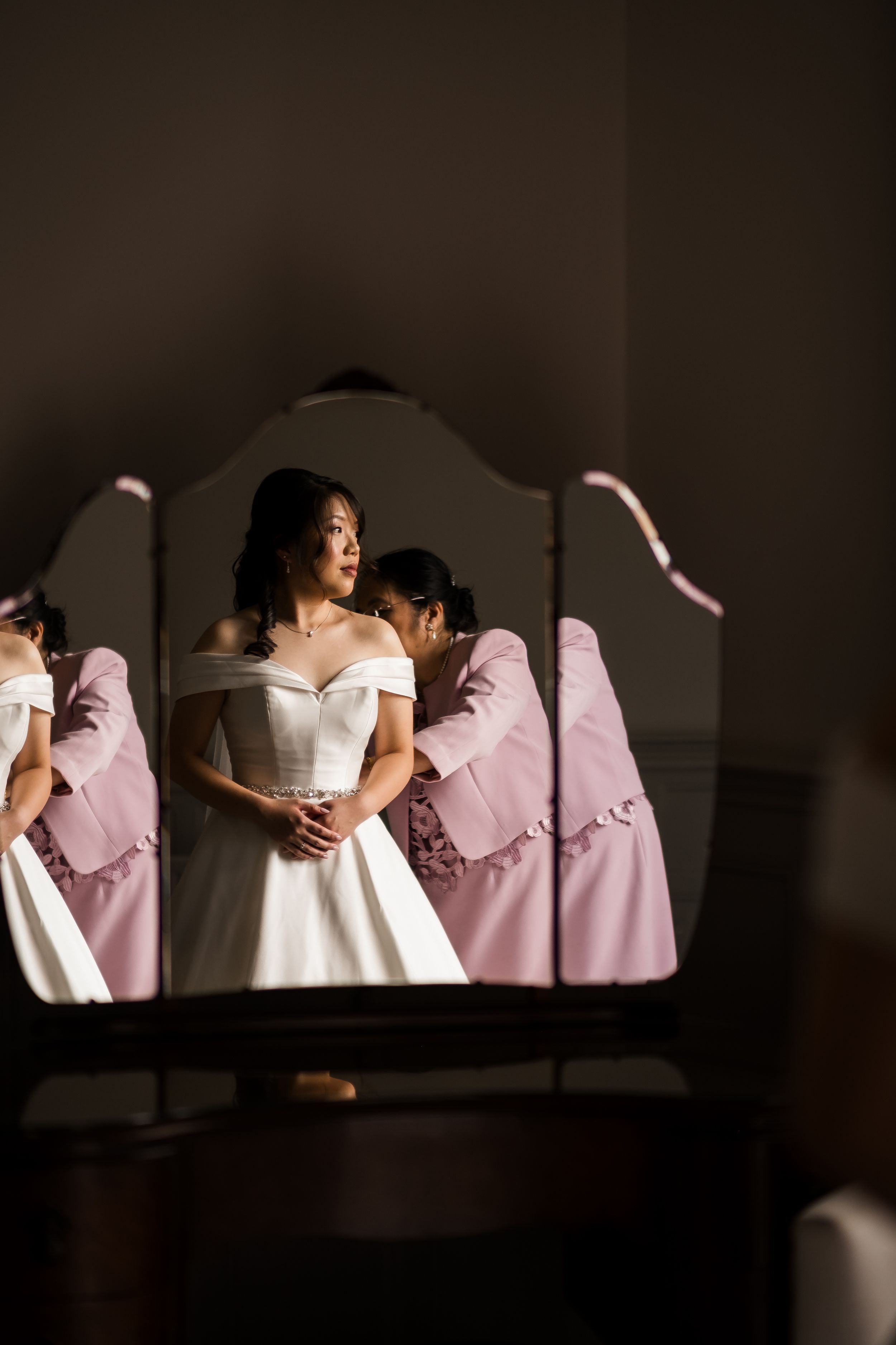 A series of four artistic wedding photos showing bridesmaids in pink dresses against a dark background.