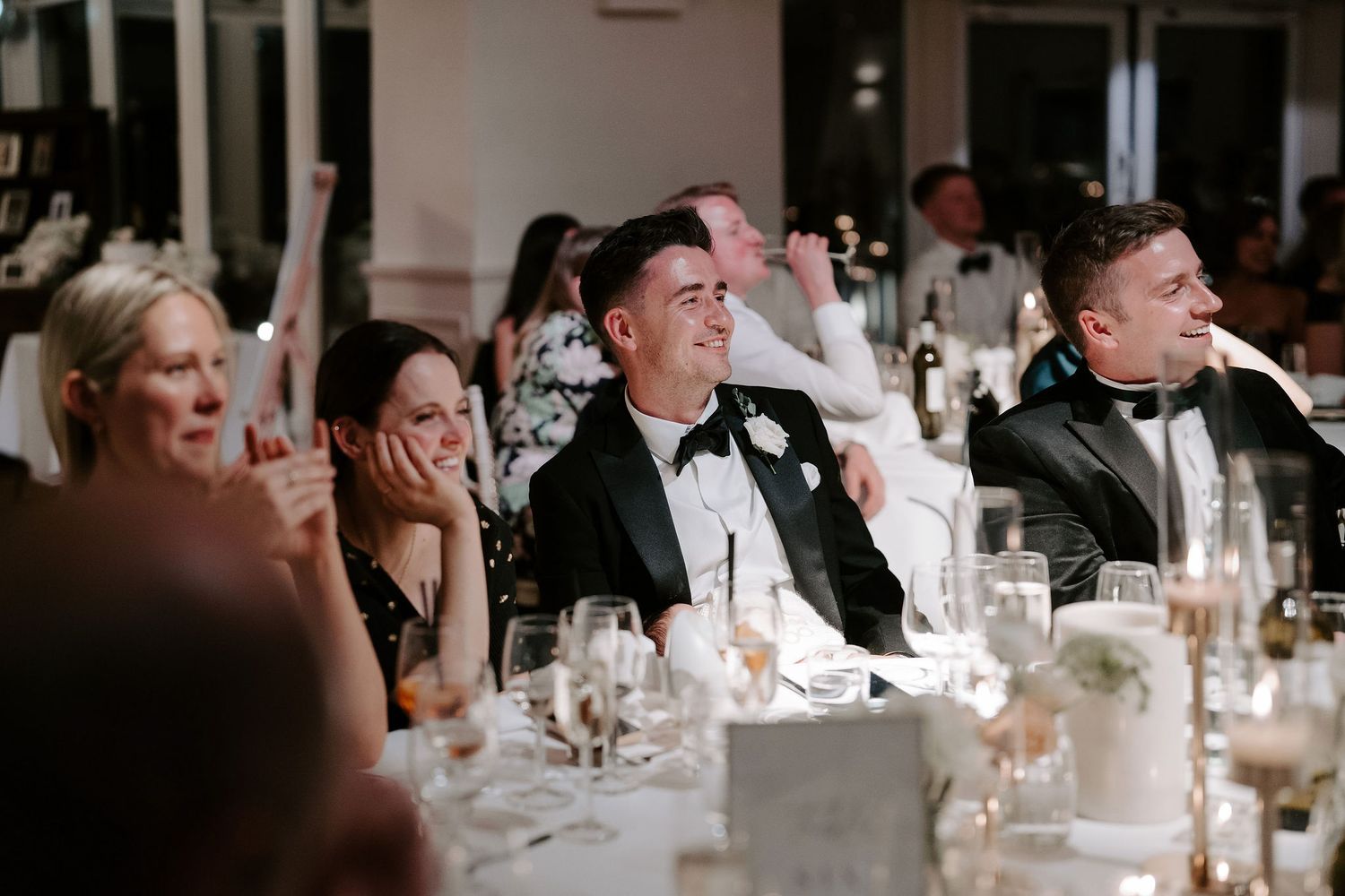wedding guests enjoying speeches at Iscoyd park