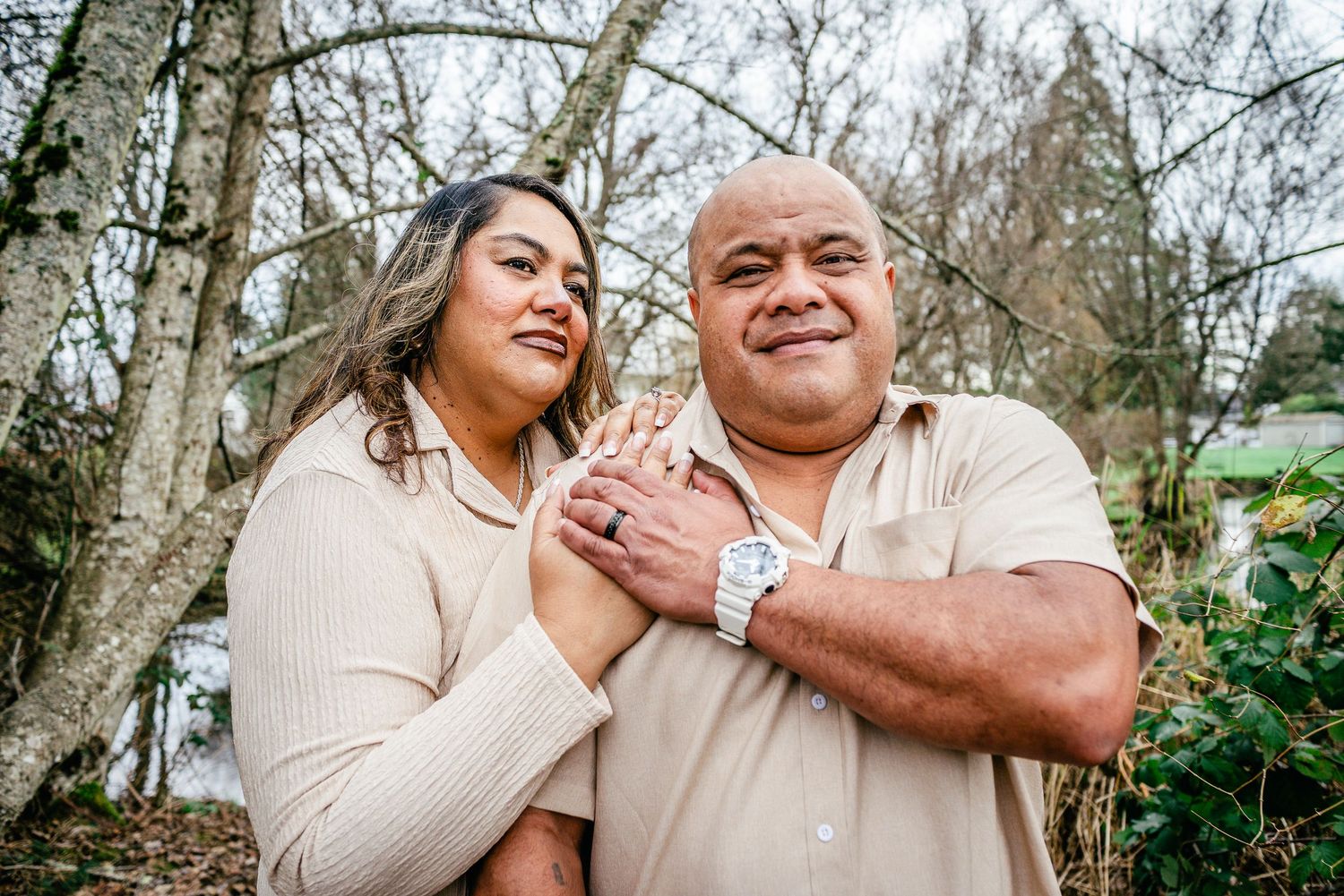 Portrait of parents embracing during a winter family photo session at DeCoursey Park in Puyallup