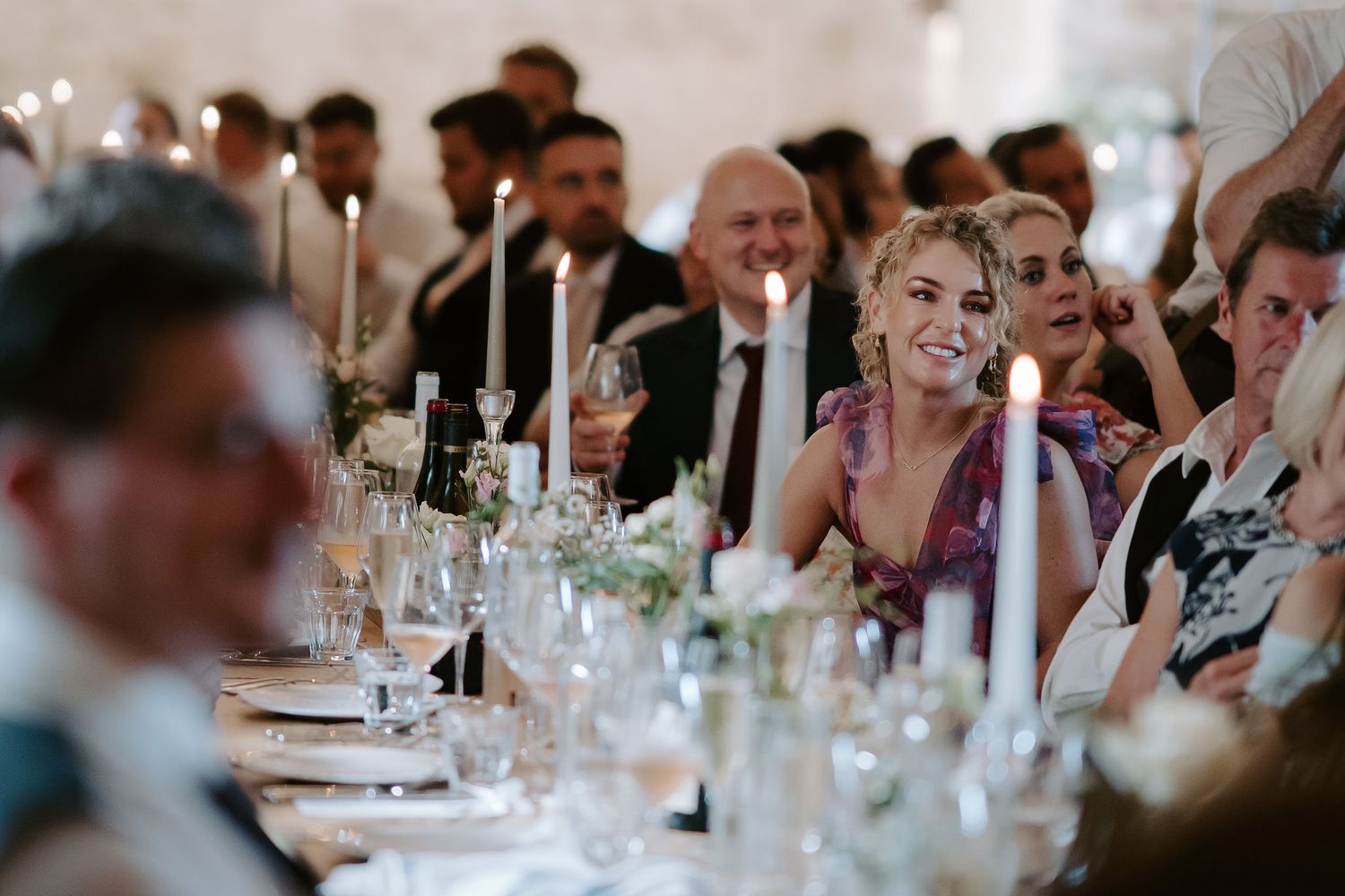 wedding guests laughing during father of bride speech at ivy lodge in cirencester
