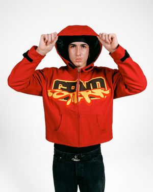 Red hooded jacket with yellow graphic lettering displayed in multiple cropped views.