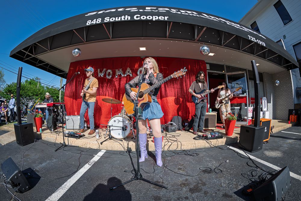 Live band performs outdoors at 848 South Cooper venue on a sunny day.