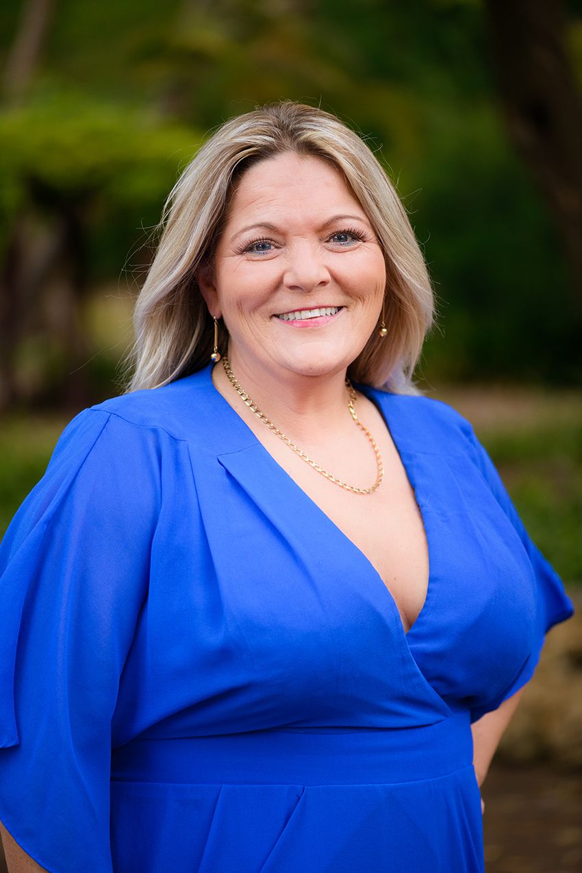 Business headshot woman in blue dress