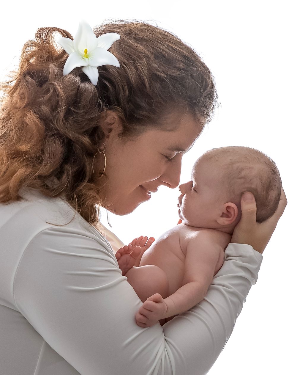 newborn baby girl with parents soft light Lakewood ranch family studio portrait emotional connection natural calm moment