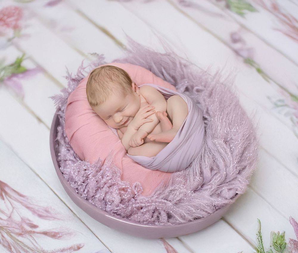 newborn baby girl with parents soft light Lakewood ranch family studio portrait emotional connection natural calm moment