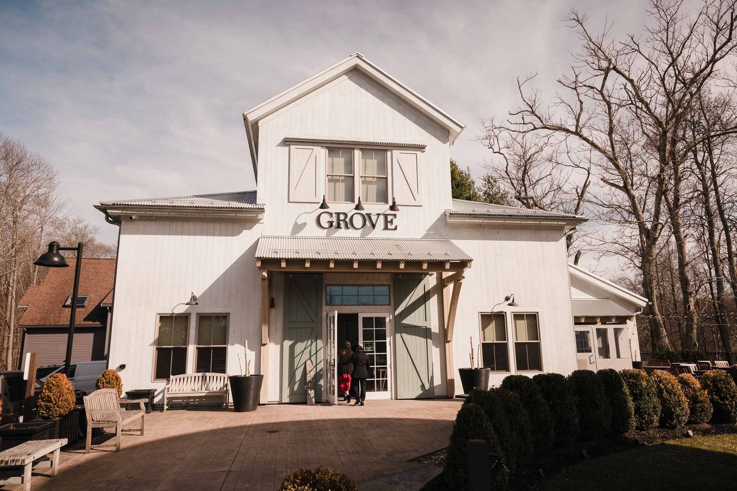 Exterior of Briar Barn Inn Grove building wedding venue with white barn facade and entrance