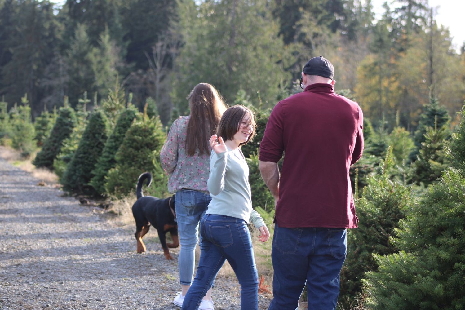 Parent and child playing together during a fun outdoor family photography session