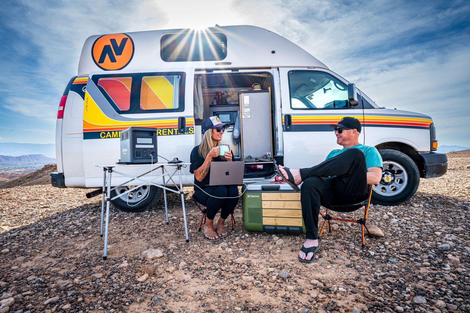 A couple relaxing outside a campervan by Denver Hospitality, Travel & Tourism photographer Captain Colorado Photography.
