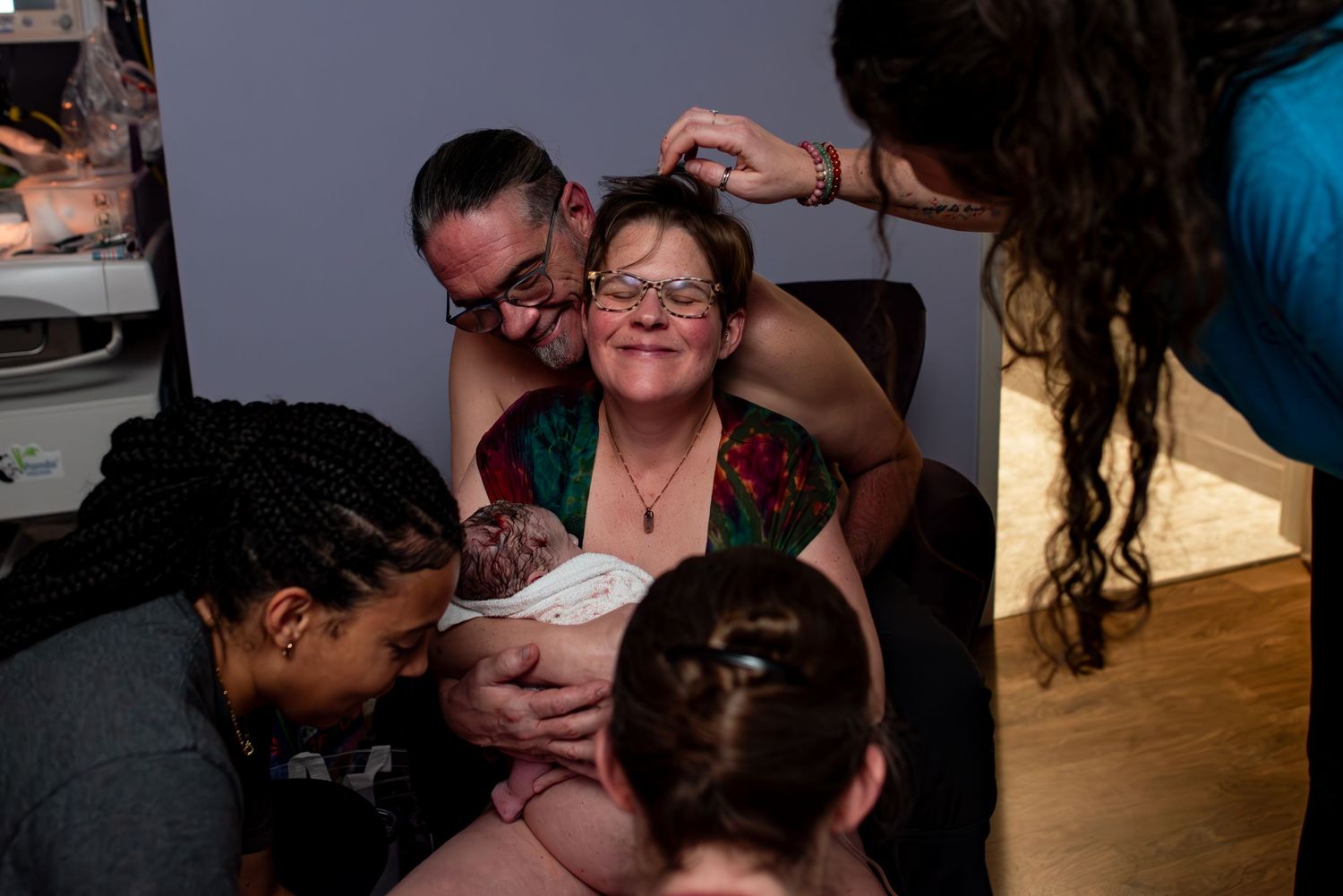 A collection of candid black and white photographs showing intimate family moments and expressions.
