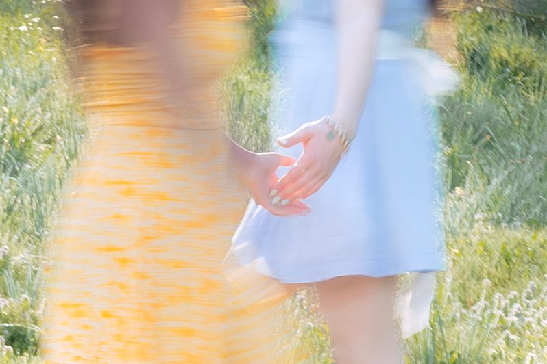 Blurred hands touching