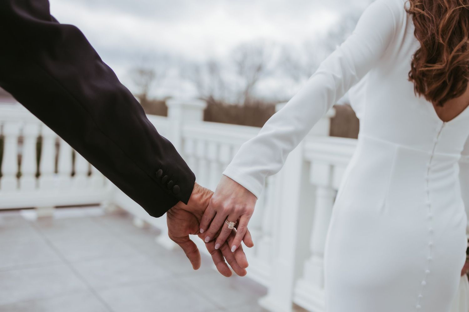 Bride and groom, wedding holding hands at Holliday Farms in Zionsville, Indiana