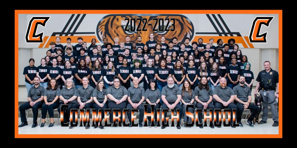 Large group portrait photograph in wide format showing the Marshall County school community in orange and black colors.