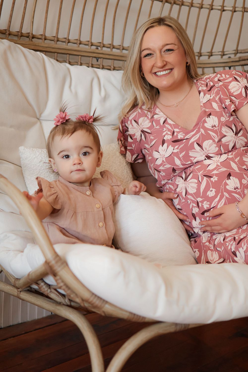Relaxed lifestyle photos on a rattan chair with white cushions and floral dress details.